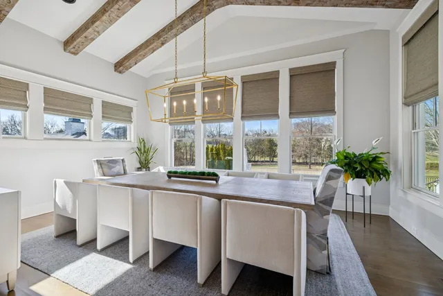 a view of a livingroom with furniture and a bookshelf