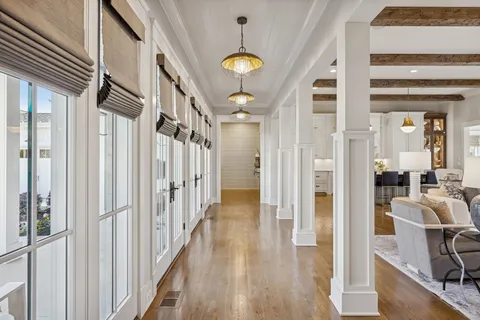 a view of a hallway view with wooden floor and staircase
