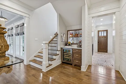 a view of entryway with stairs and wooden floor