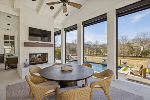 a view of a dining room with furniture window and outside view