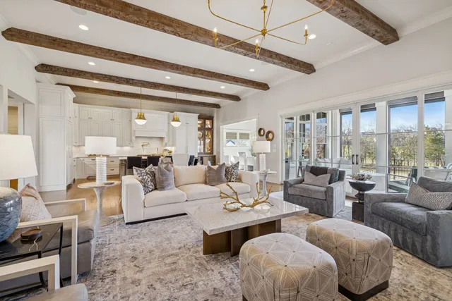 a spacious bathroom with a double vanity sink a mirror and a shower