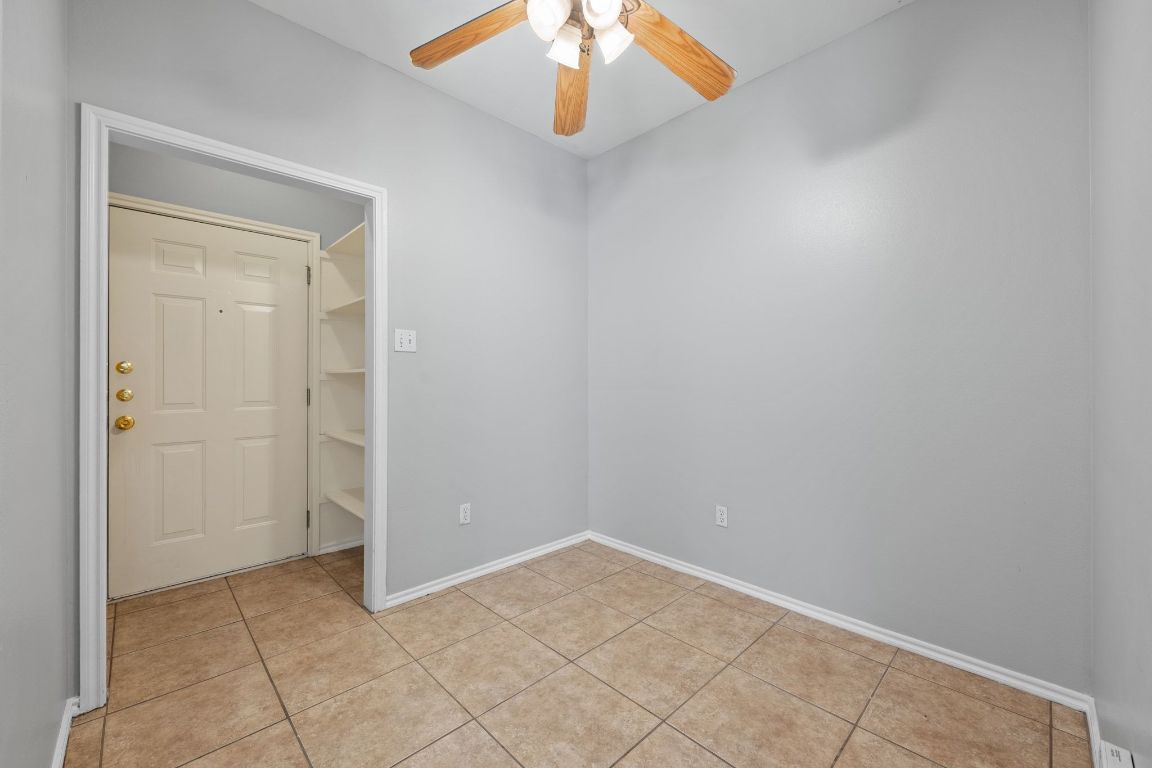 2906 Pearl Street, Unit B Austin, TX 78705 - Photo 13 of 30 Unfurnished room with light tile patterned floors and a ceiling fan