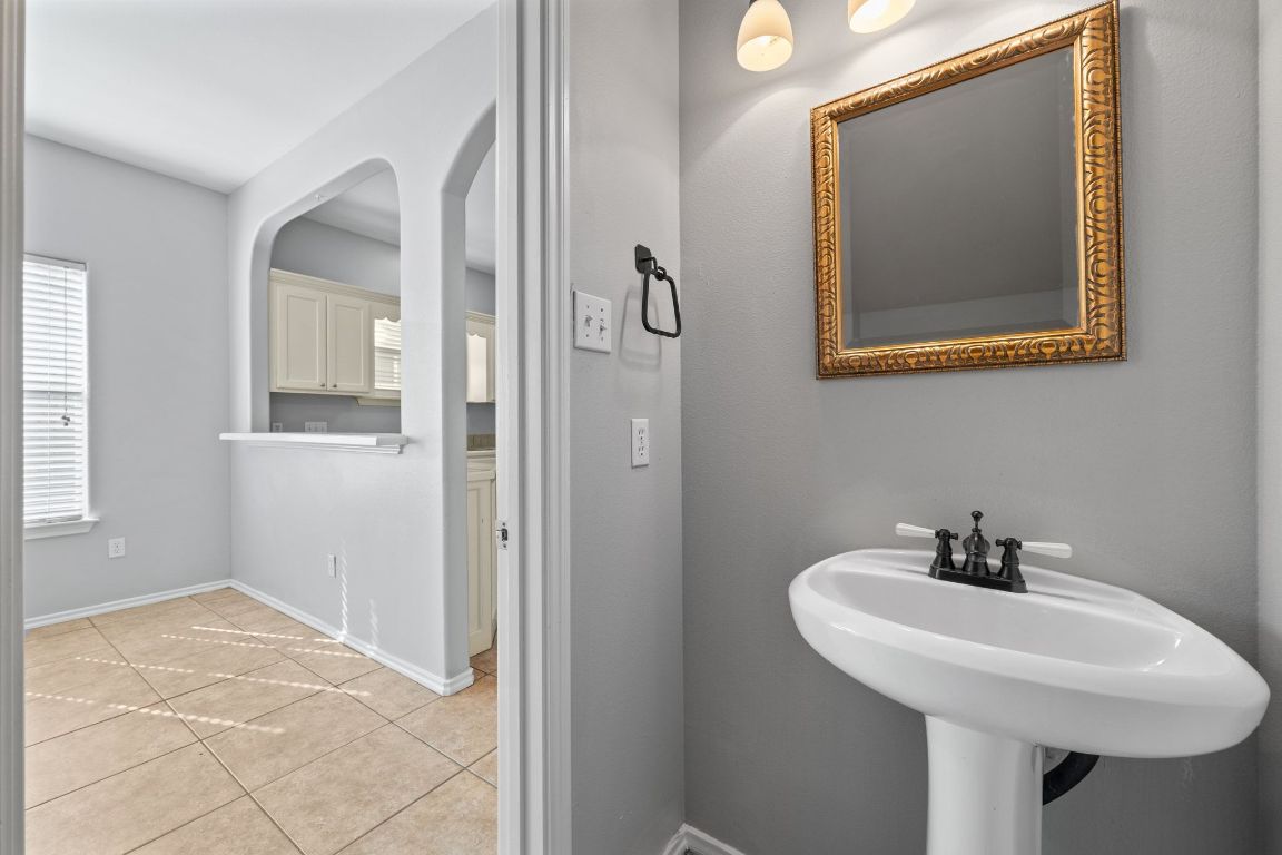2906 Pearl Street, Unit B Austin, TX 78705 - Photo 14 of 30 Bathroom featuring light tile patterned floors and baseboards
