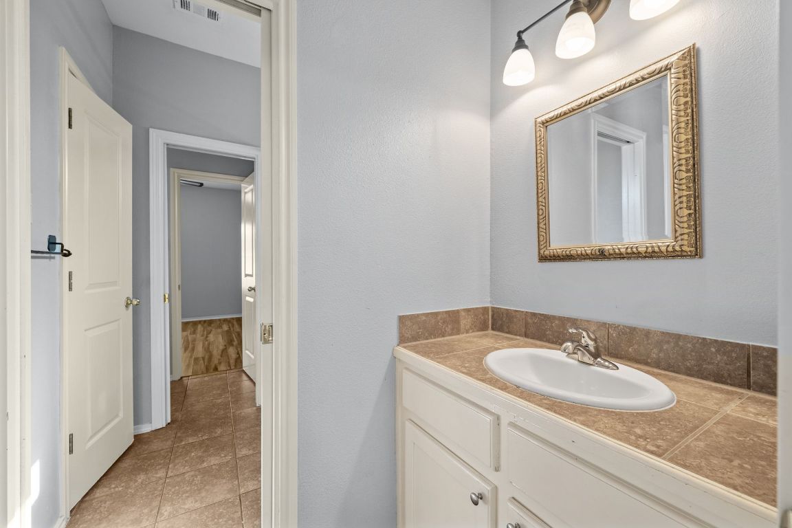 2906 Pearl Street, Unit B Austin, TX 78705 - Photo 16 of 30 Bathroom with vanity and light tile patterned flooring