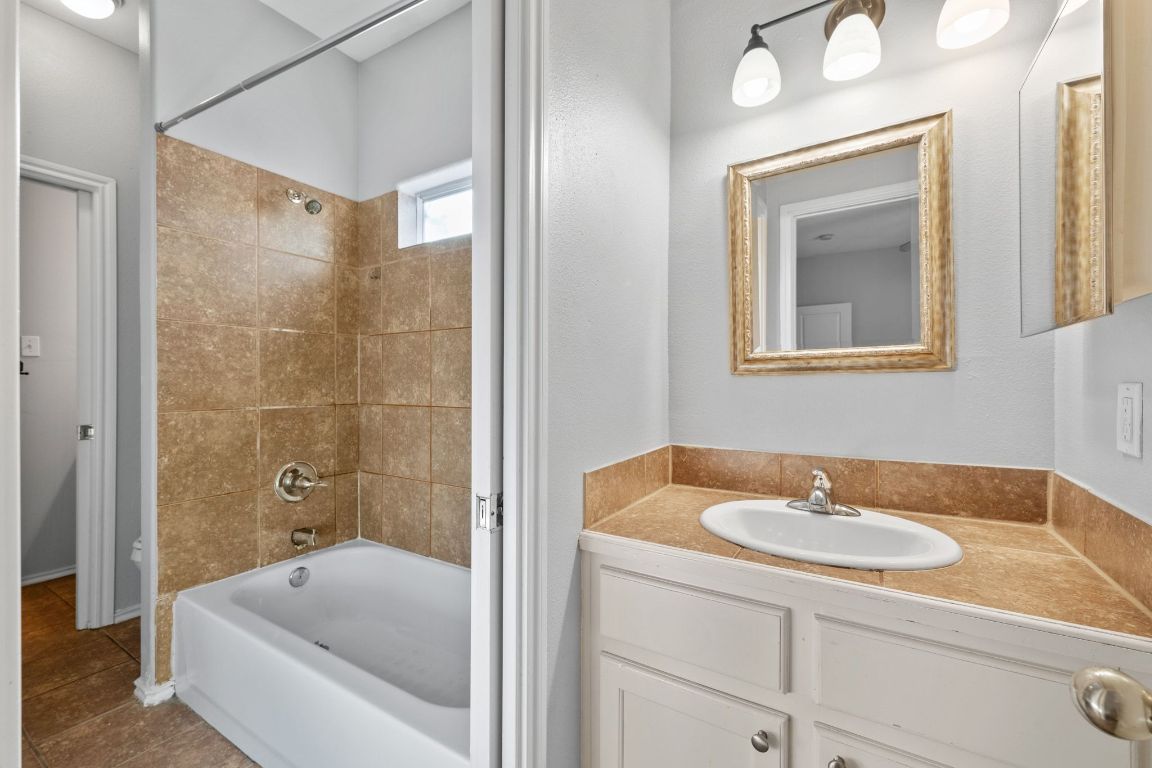2906 Pearl Street, Unit B Austin, TX 78705 - Photo 19 of 30 Full bath featuring bathtub / shower combination, vanity, and tile patterned flooring