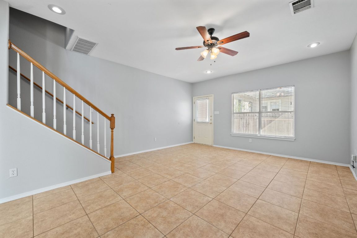 2906 Pearl Street, Unit B Austin, TX 78705 - Photo 5 of 30 Spare room featuring recessed lighting, a ceiling fan, light tile patterned flooring, and stairs