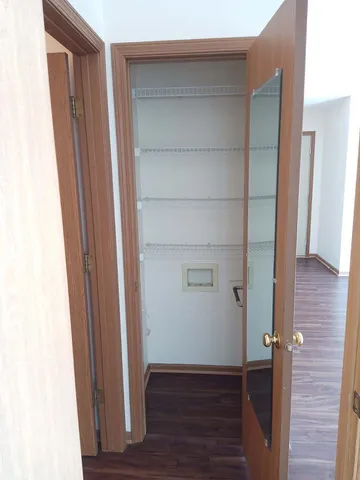 a view of front door with wooden floor