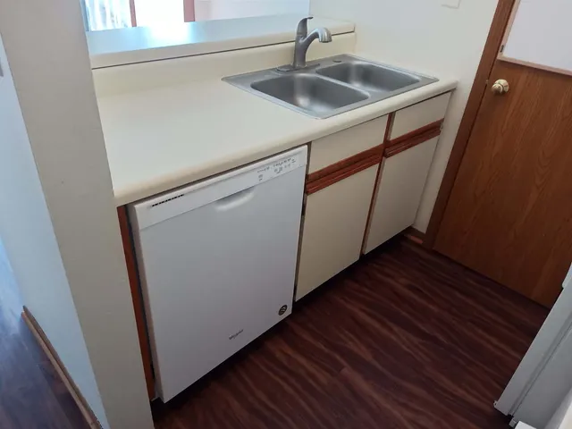 a utility room with sink dryer and washer
