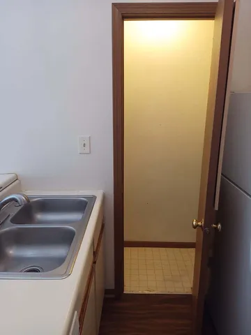 a bathroom with a sink and washing machine