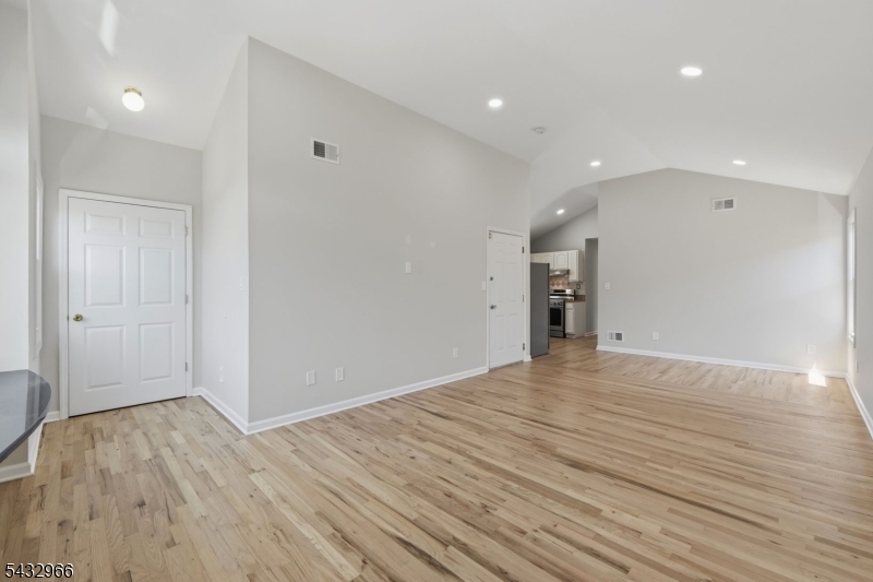 130 3rd Street, Unit 2 Passaic, NJ 07055 - Photo 6 of 12 a view of empty room with wooden floor