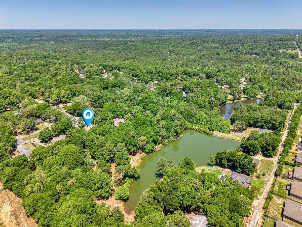210 Shell Drive Crestview, FL 32536 - Photo 64 of 67 a view of a green field with lots of bushes