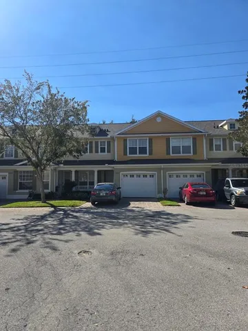 a kitchen with stainless steel appliances granite countertop a refrigerator and a stove