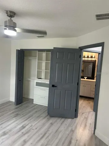 a view of a house with a garden and deck