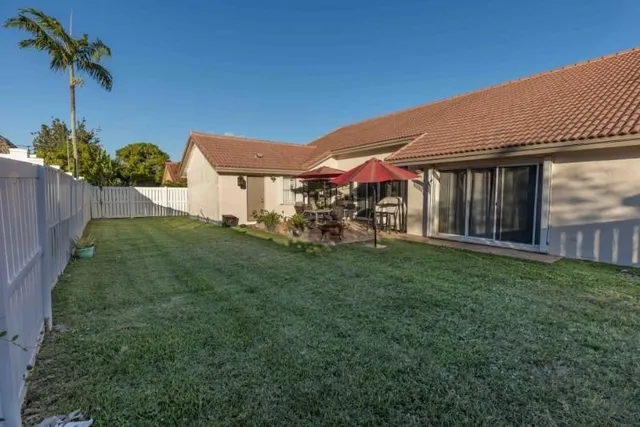 a view of a house with a yard