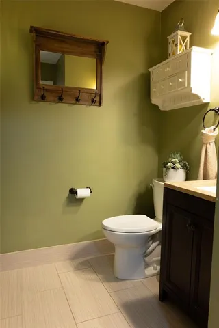 a bathroom with a toilet and a sink