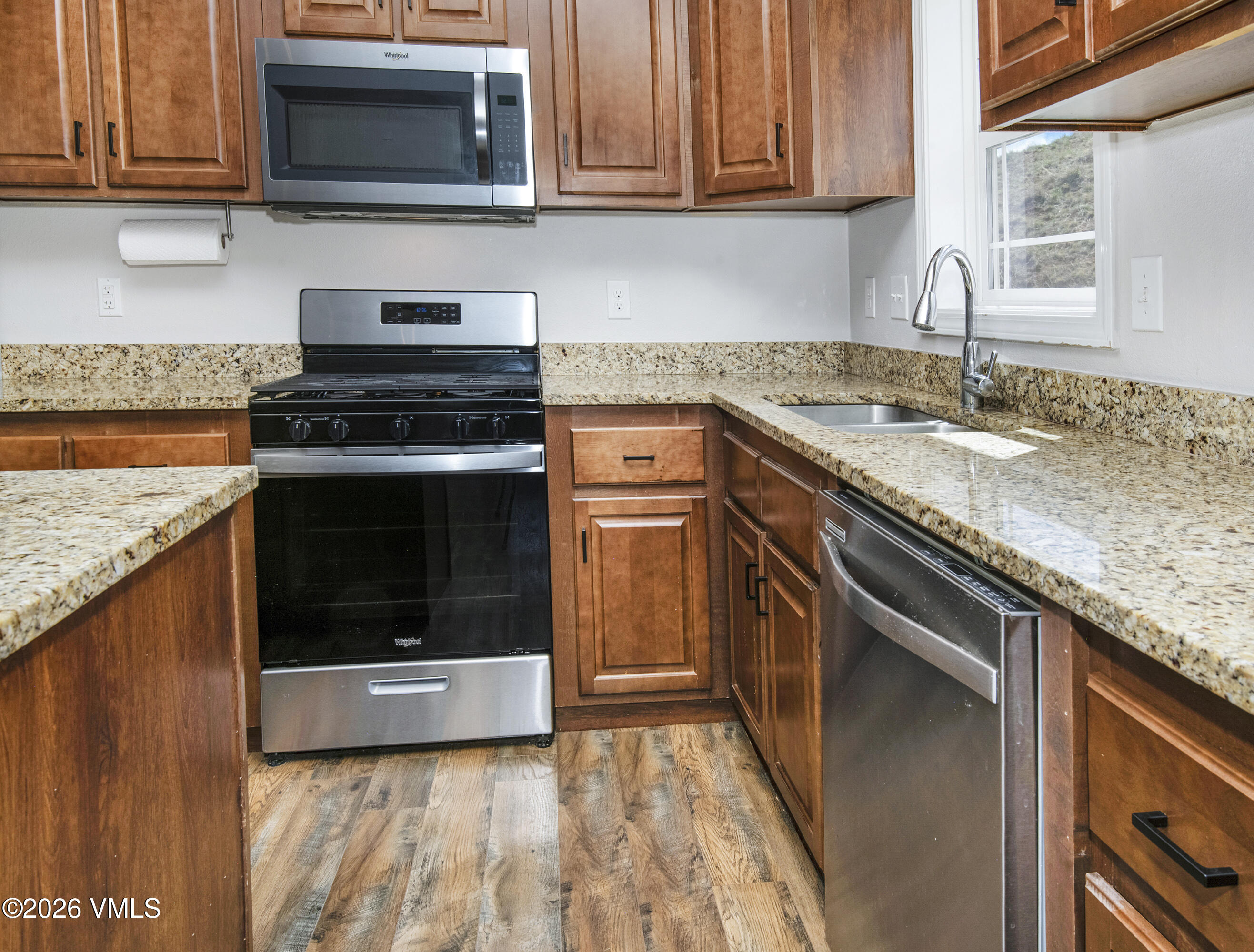 67 Maverick Court Gypsum, CO 81637 - Photo 10 of 40 a kitchen with a stove and a microwave