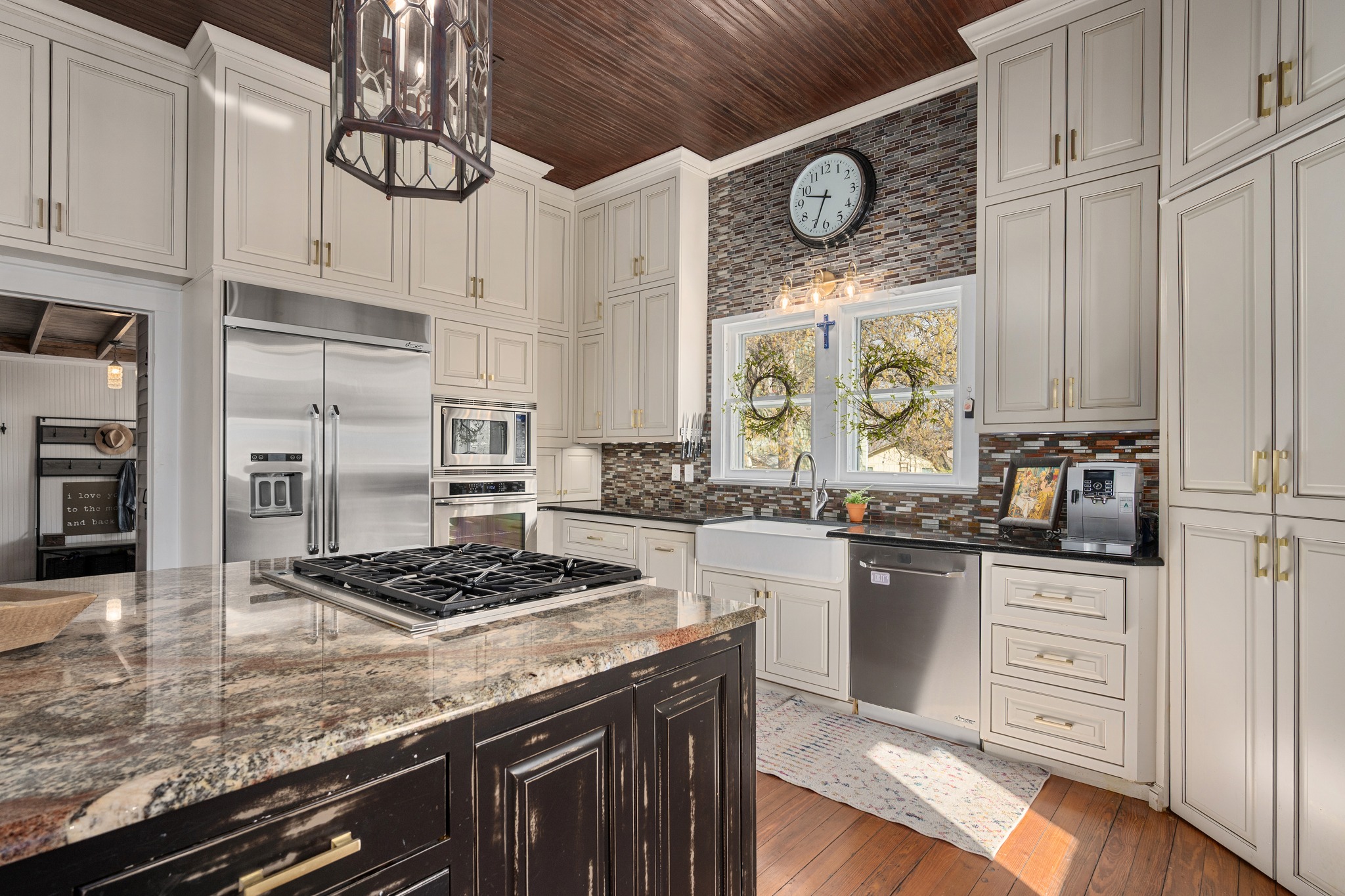 603 East 7th Street Georgetown, TX 78626 - Photo 8 of 33 a kitchen with stainless steel appliances granite countertop a stove sink and cabinets