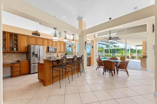a kitchen with stainless steel appliances granite countertop a stove and a sink