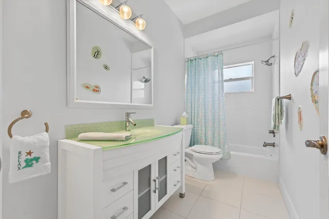 a view of a house with backyard sitting area and porch