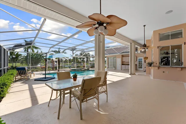 a view of a backyard with sitting area