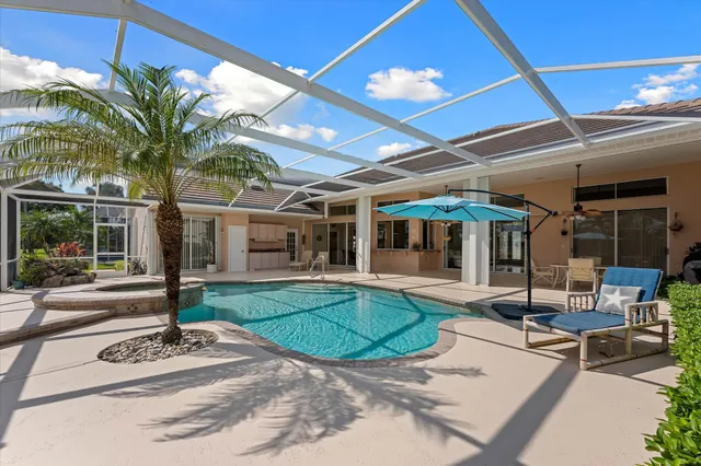 a front view of a house with a yard table and chairs