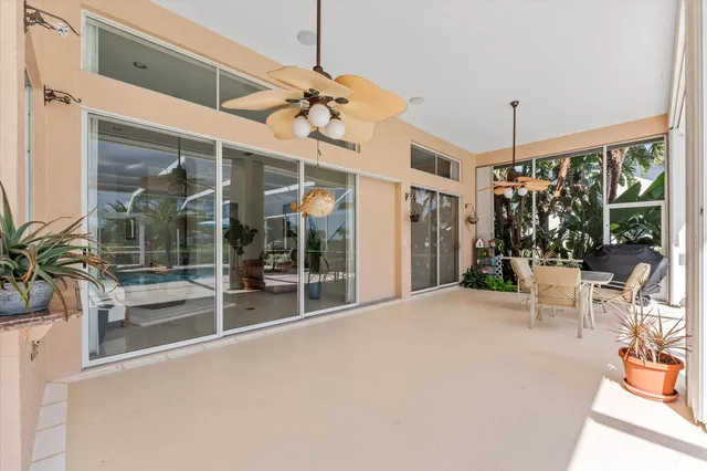 a view of a swimming pool with an outdoor seating