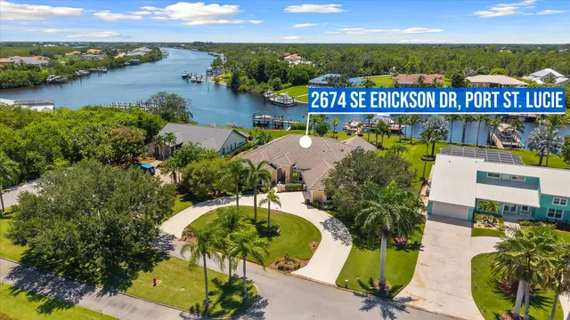 a room with lot of furniture and a chandelier