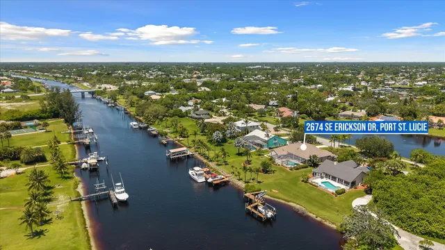 an aerial view of a house with a lake view