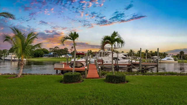 an aerial view of lake residential house with swimming pool and outdoor space