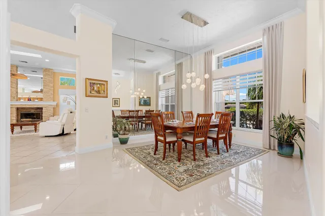 a dining room with furniture and wooden floor