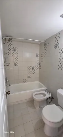 a bathroom with a toilet a sink and a bathtub