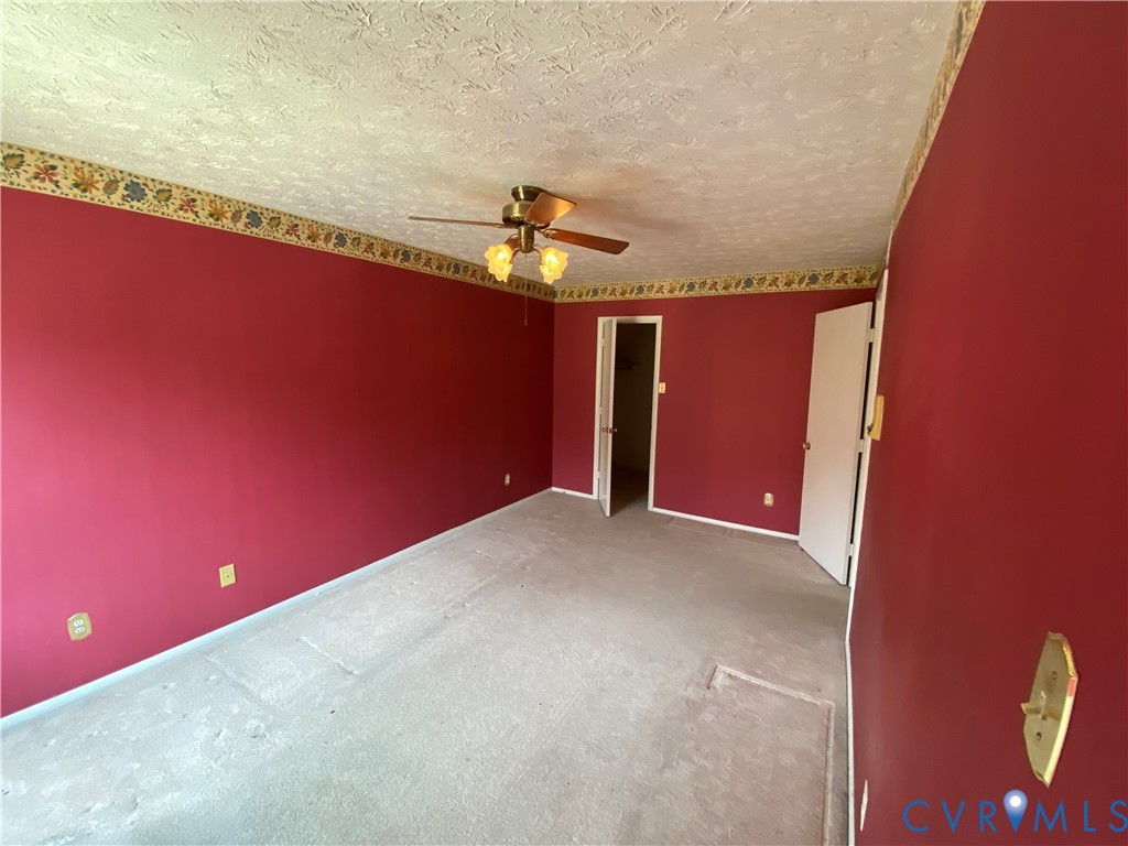 1507 Bronwyn Road, Unit 301 Henrico, VA 23238 - Photo 18 of 41 a view of a livingroom with an empty space and a ceiling fan