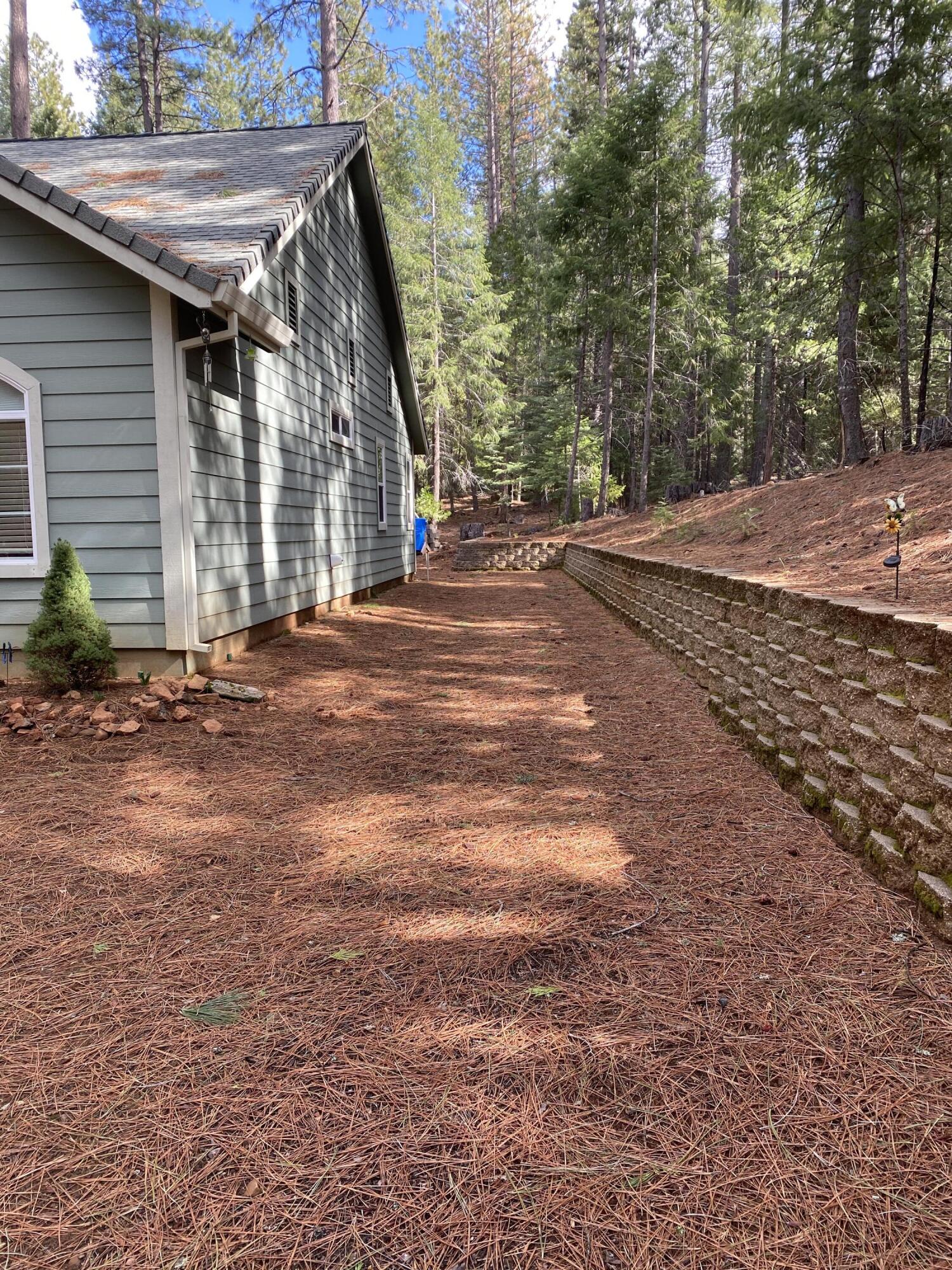 7517 Red Eagle Road Shingletown, CA 96088 - Photo 6 of 43 side yard and retaining wall