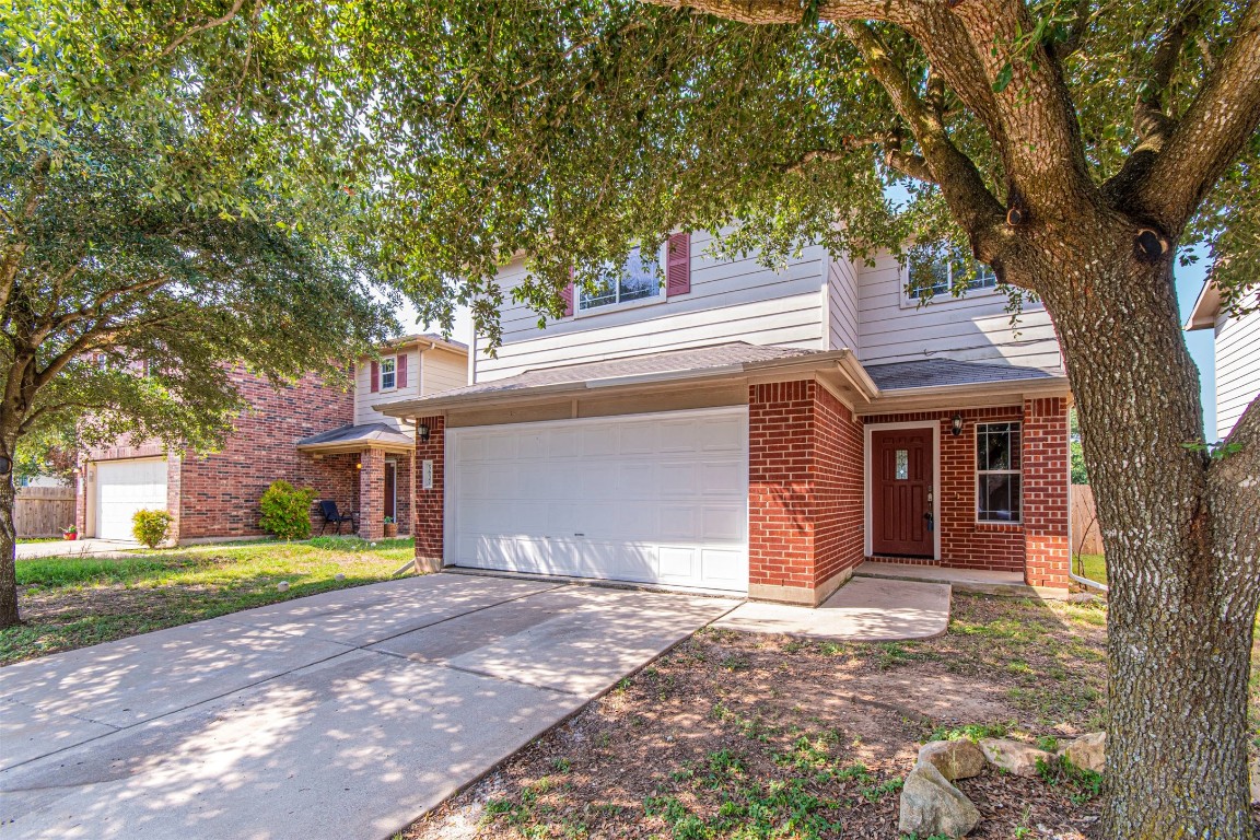 5637 Liberton Lane Austin, TX 78754 - Photo 1 of 1 a front view of a house with a yard and garage