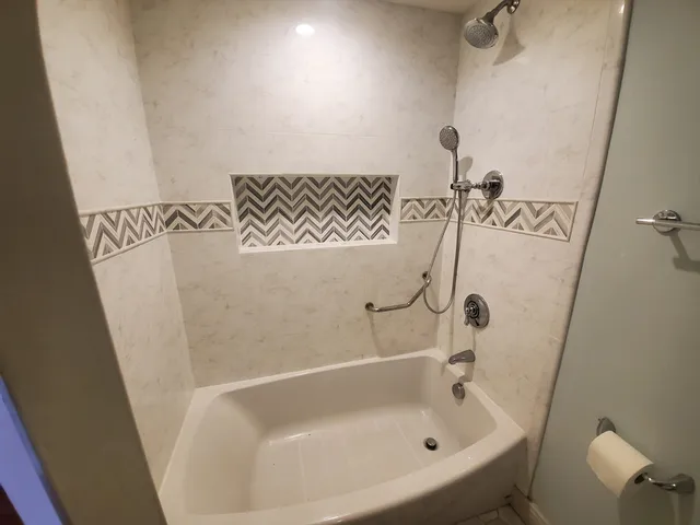 a bathroom with a white bath tub