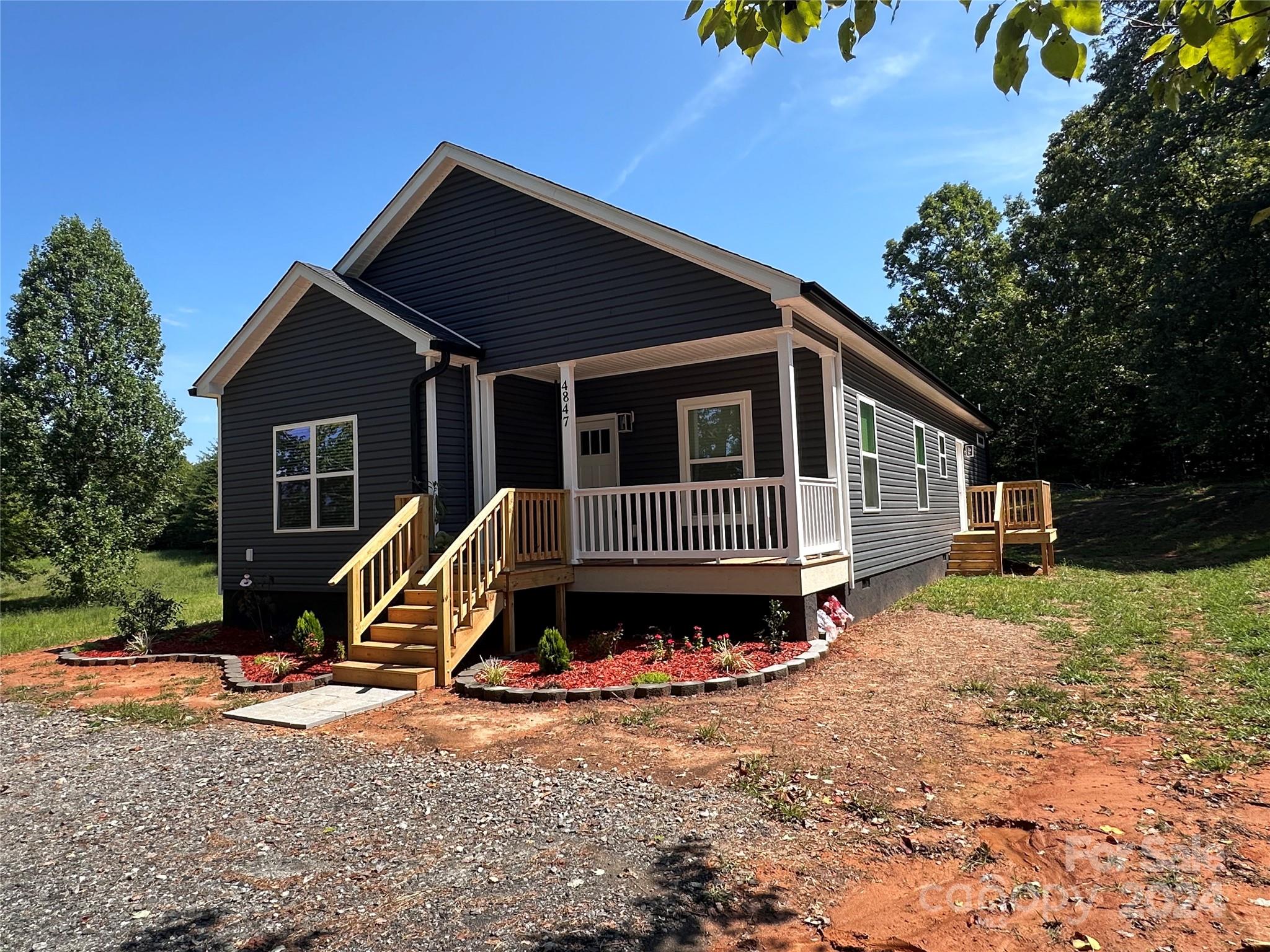 4847 Charlie Crawley Road, Unit 2 Morganton, NC 28655 - Photo 1 of 36 a view of a house with a yard