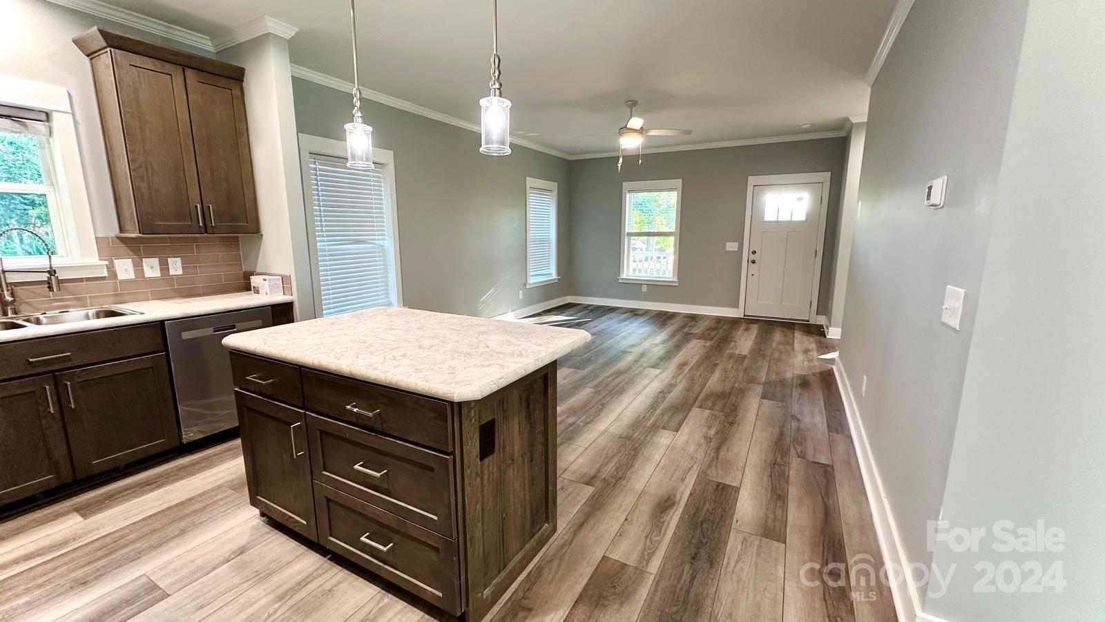 4847 Charlie Crawley Road, Unit 2 Morganton, NC 28655 - Photo 12 of 36 a kitchen with a sink and wooden floor