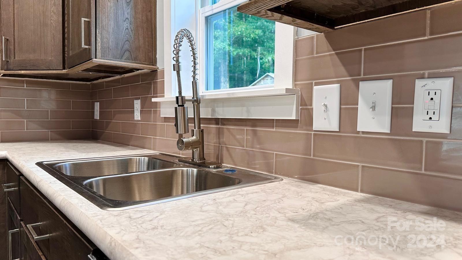 4847 Charlie Crawley Road, Unit 2 Morganton, NC 28655 - Photo 15 of 36 a close view of sink and tap