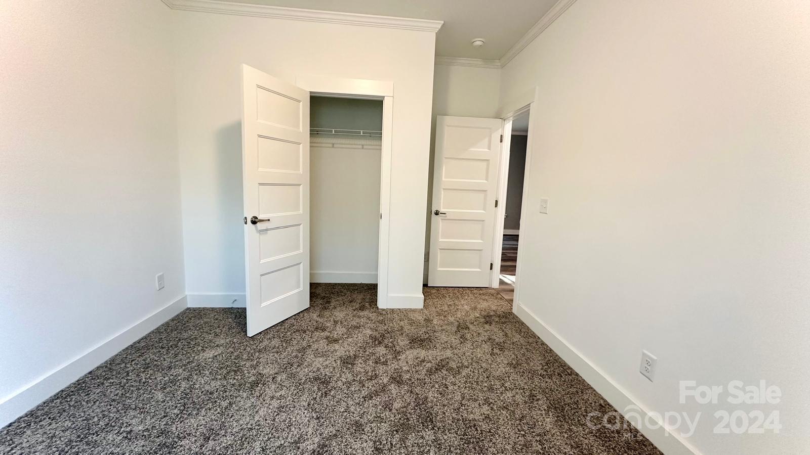 4847 Charlie Crawley Road, Unit 2 Morganton, NC 28655 - Photo 24 of 36 an empty room with an entrance to other room