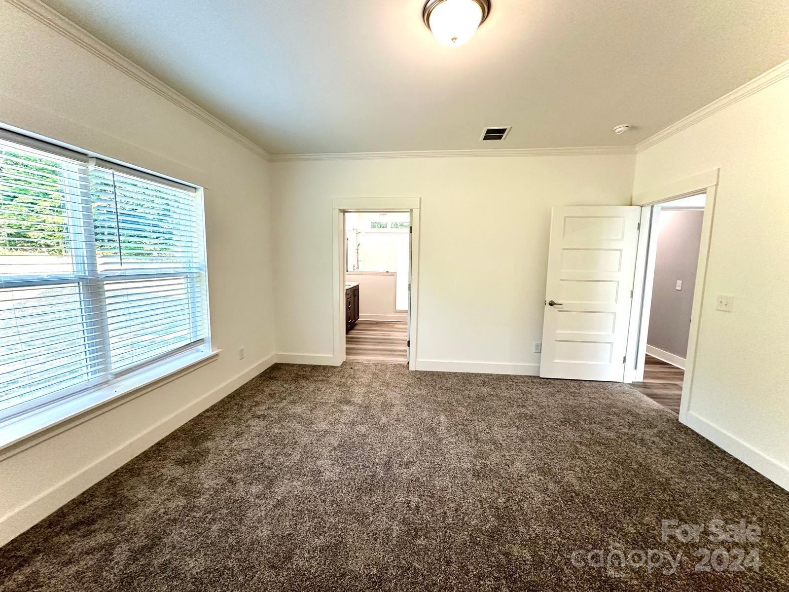 4847 Charlie Crawley Road, Unit 2 Morganton, NC 28655 - Photo 25 of 36 a view of an empty room with a window