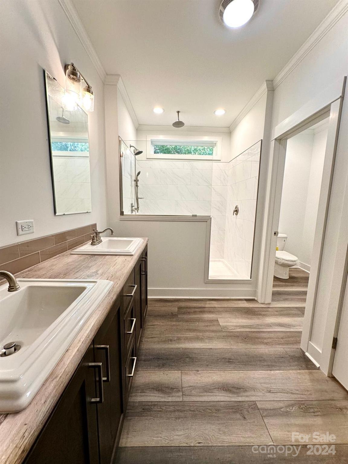 4847 Charlie Crawley Road, Unit 2 Morganton, NC 28655 - Photo 27 of 36 a bathroom with a sink and a mirror