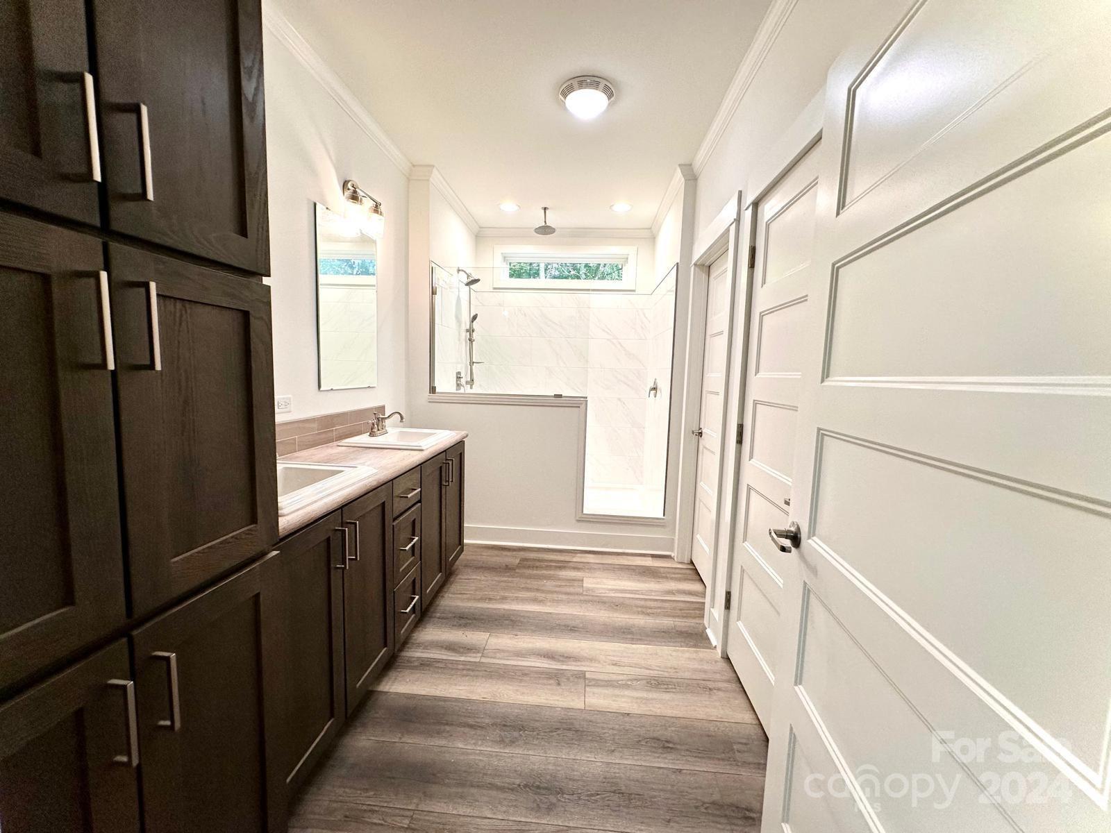 4847 Charlie Crawley Road, Unit 2 Morganton, NC 28655 - Photo 29 of 36 a large white kitchen with a large window