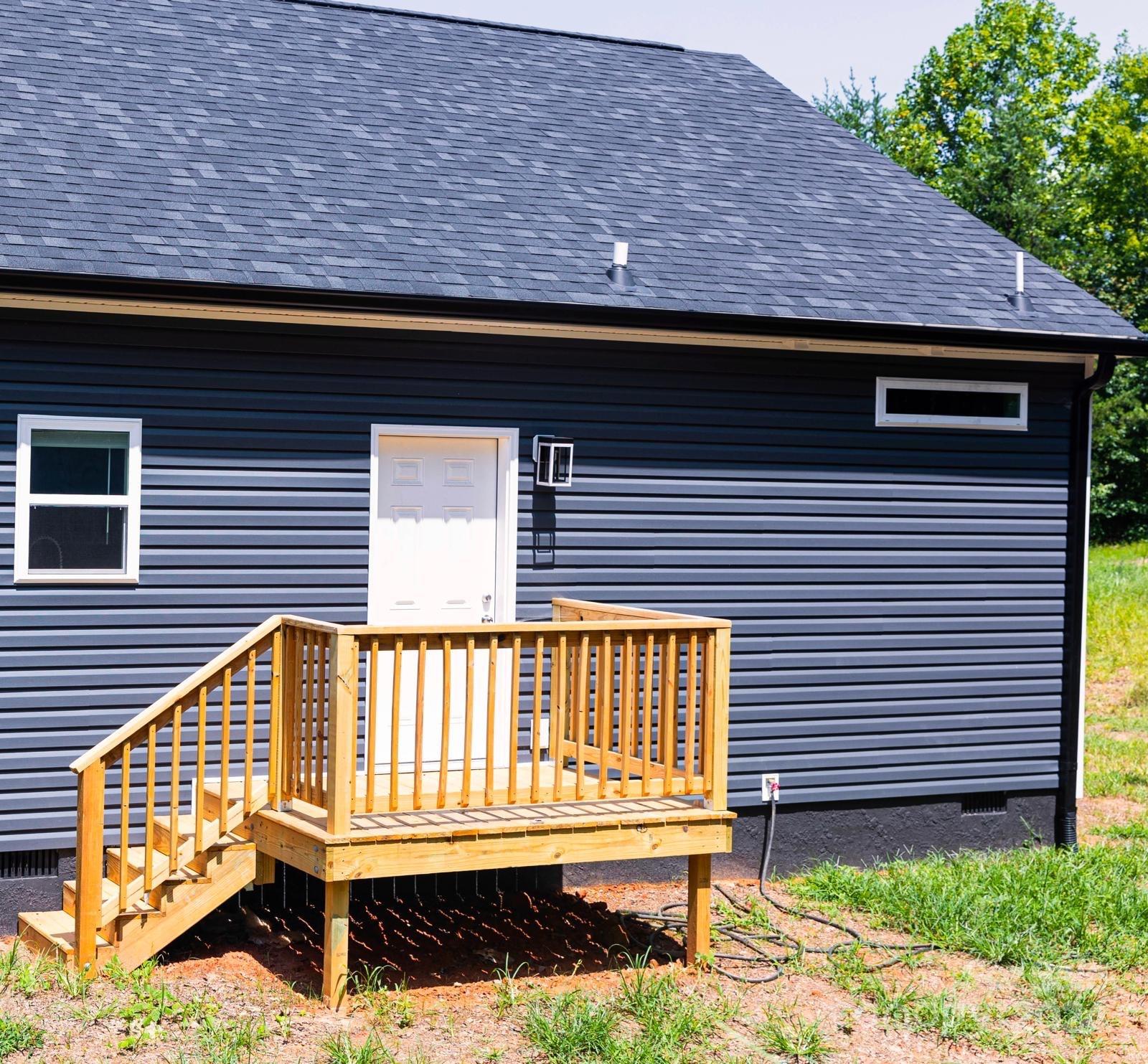 4847 Charlie Crawley Road, Unit 2 Morganton, NC 28655 - Photo 3 of 36 a view of a wooden door with a bench