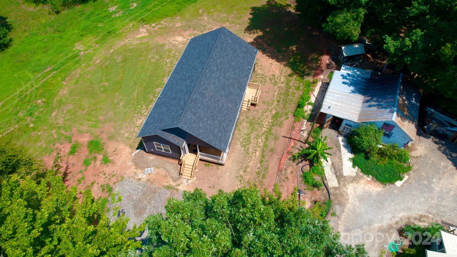 4847 Charlie Crawley Road, Unit 2 Morganton, NC 28655 - Photo 34 of 36 an aerial view of a house with swimming pool and garden
