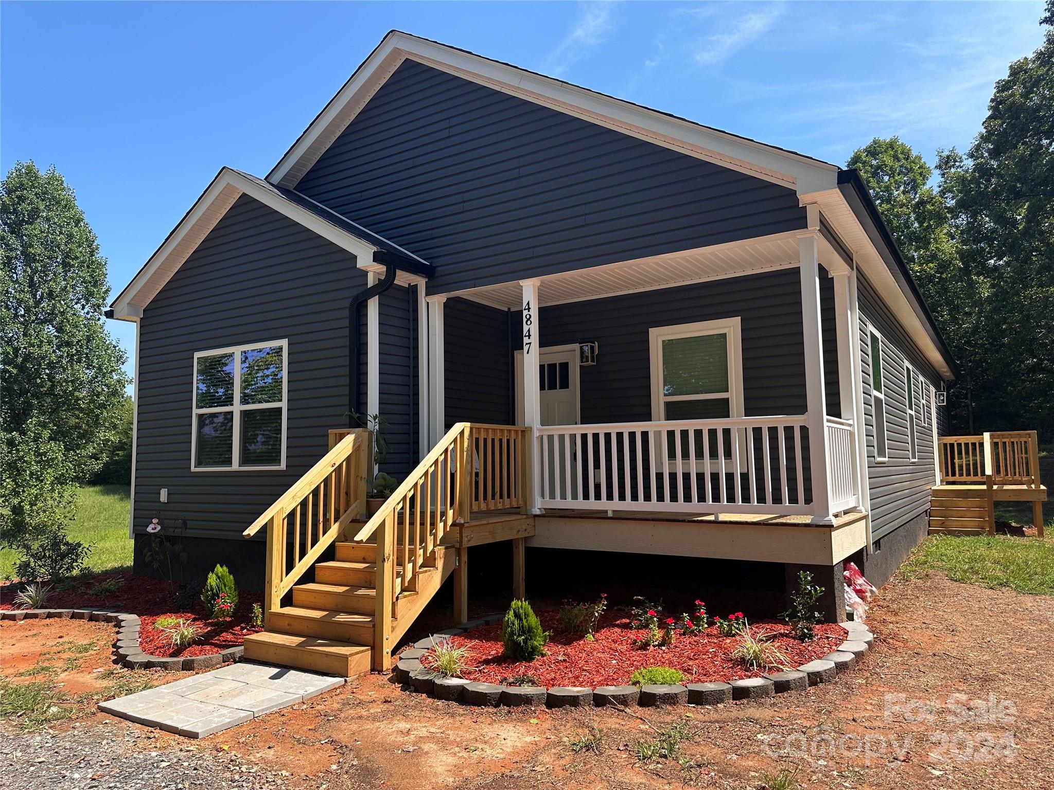 4847 Charlie Crawley Road, Unit 2 Morganton, NC 28655 - Photo 36 of 36 a view of a house with a roof deck