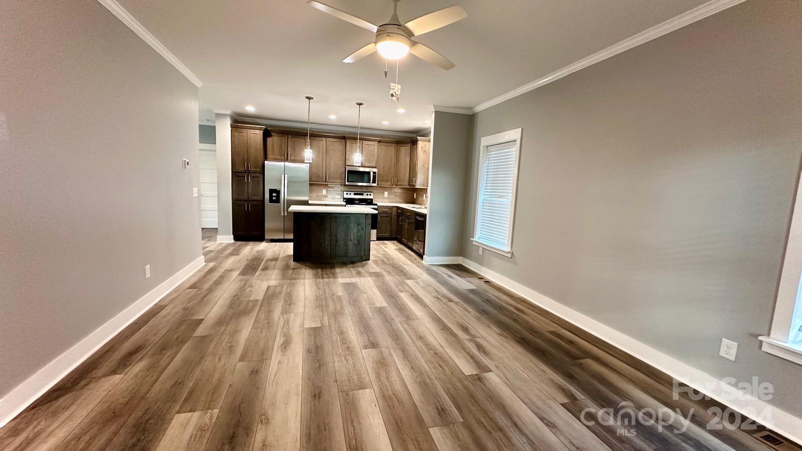 4847 Charlie Crawley Road, Unit 2 Morganton, NC 28655 - Photo 7 of 36 a view of kitchen with sink and wooden floor