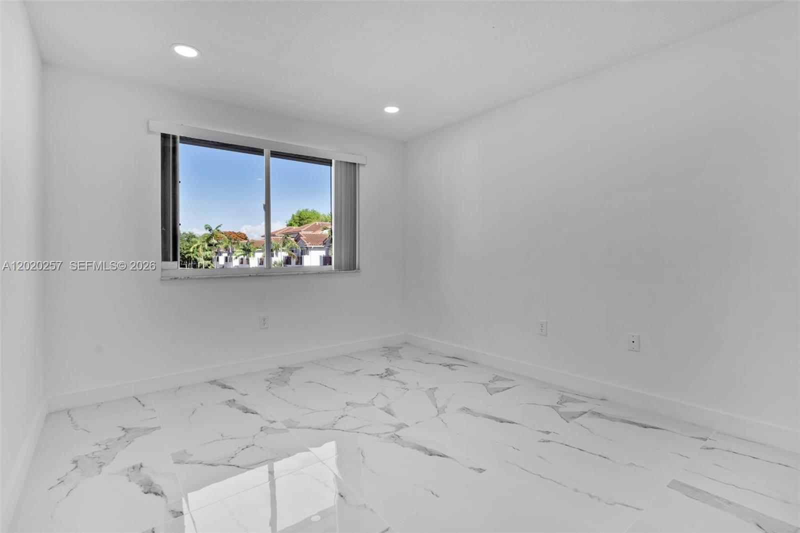 10245 Southwest 154th Place, Unit 1123 Miami, FL 33196 - Photo 23 of 38 an empty room with windows