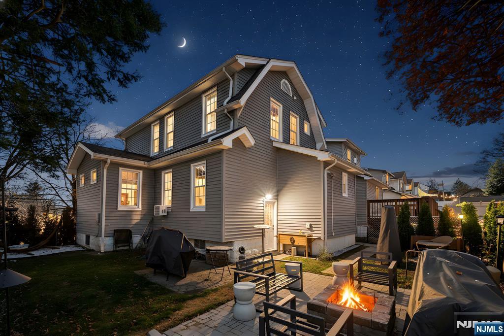 71 Spring Street Nutley, NJ 07110 - Photo 1 of 50 a front view of a house with a yard