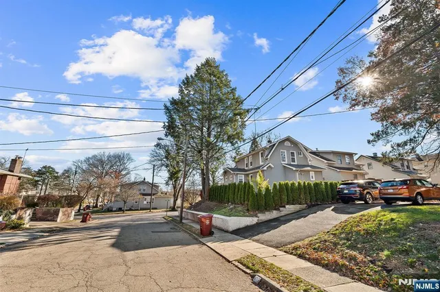 a view of a pathway with a tree