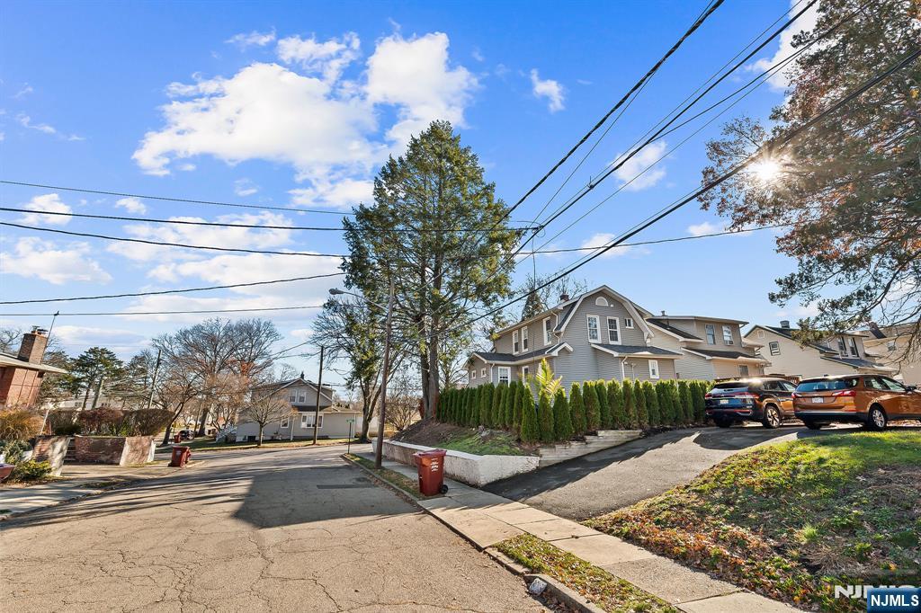 71 Spring Street Nutley, NJ 07110 - Photo 11 of 50 a view of a street with a cars parked in front of it